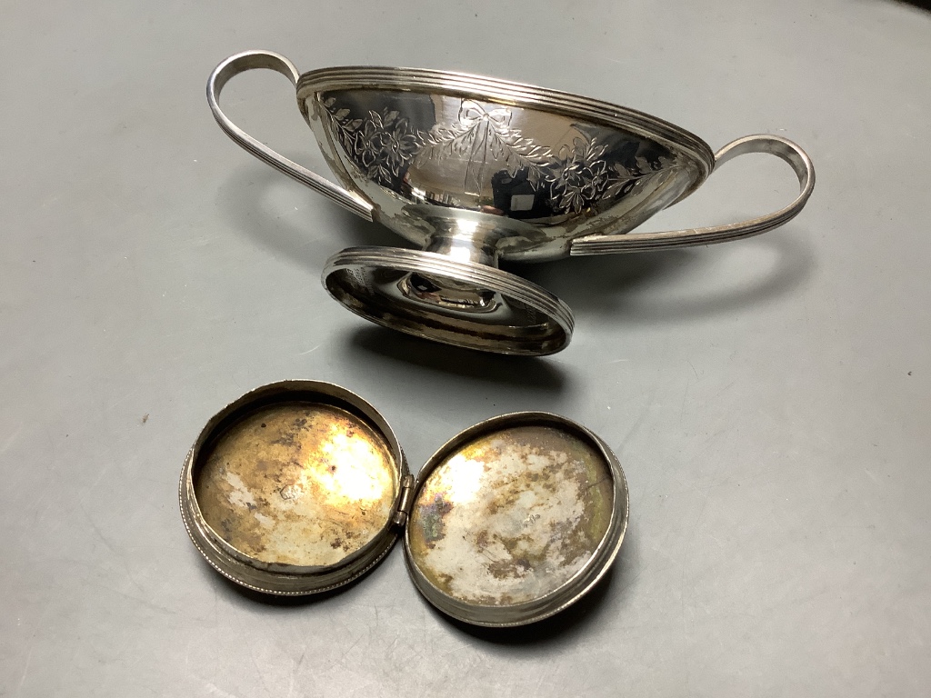 Two silver baby's rattles (a.f.), a Dutch white metal pill box, a silver two handled salt and four plated items.